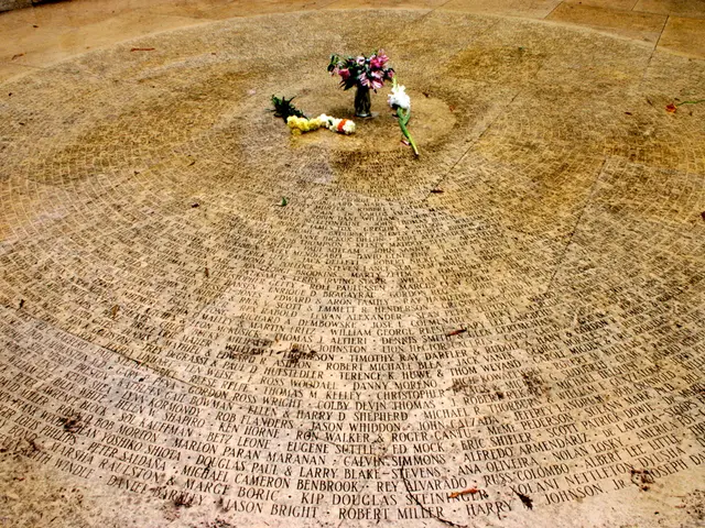 In the picture I can see the flowers and flower vase on the floor and there is a text on the floor.